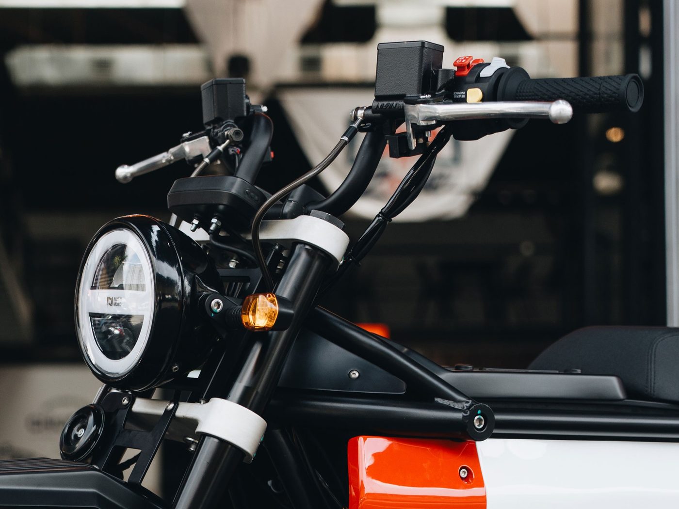 Bars, levers, switchgear and the single instrument pod on the running prototype.